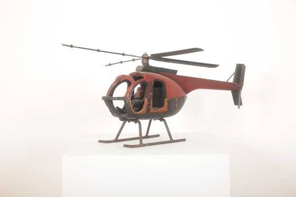 A MODEL HELICOPTER WITH PILOT