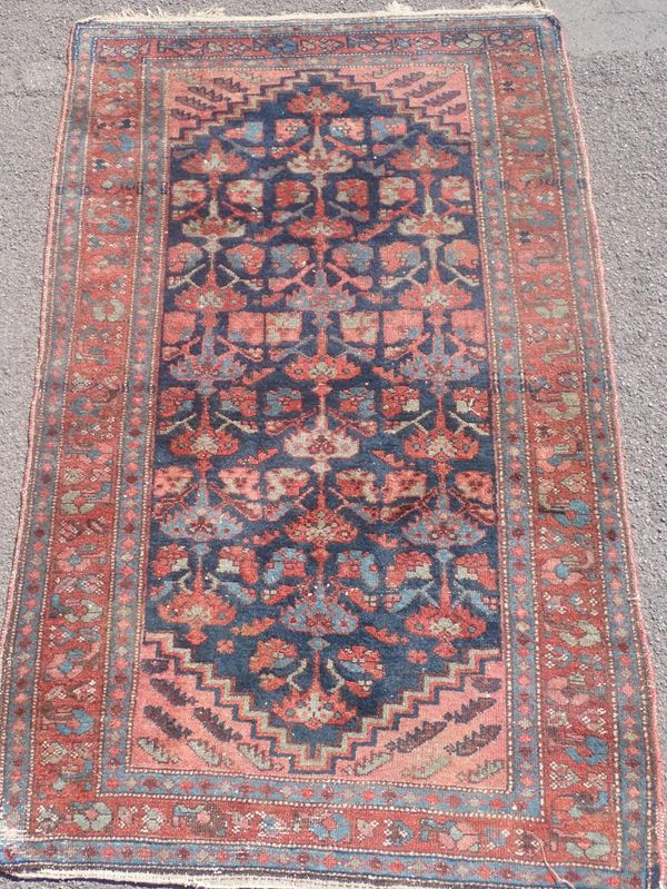 A BIDJAR RUG, IN REDS AND BLUES