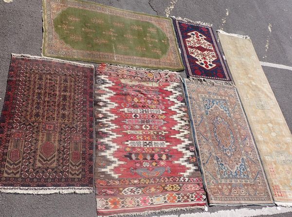 A COLLECTION OF SIX RUGS