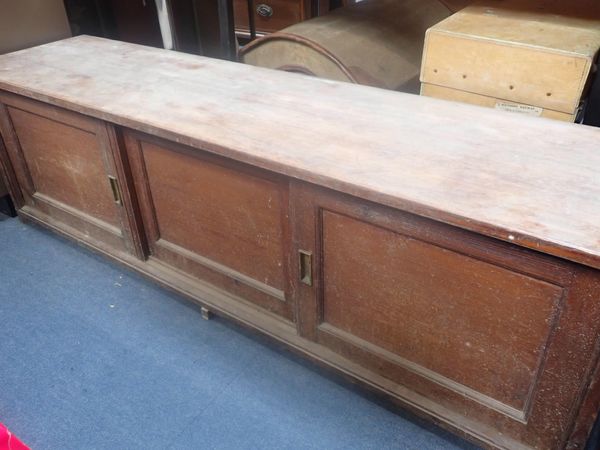 AN EDWARDIAN PITCH PINE CUPBOARD