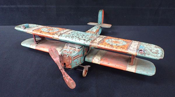 A GERMAN TINPLATE TOY BIPLANE, IN THE STYLE OF DISTLER