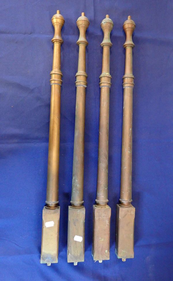 A SET OF FOUR BRASS  POSTS