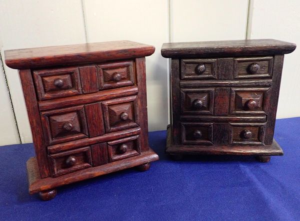 A PAIR OF NOVELTY TREEN MONEY BOXES, by 'CHEW'