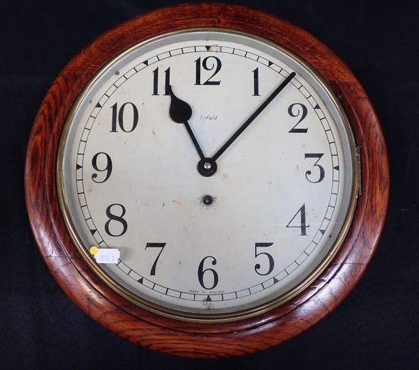 AN ENFIELD OAK-CASED DIAL CLOCK