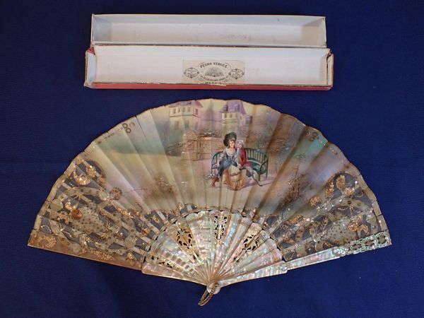 A PIERCED AND GILT MOTHER OF PEARL, AND PAINTED FAN