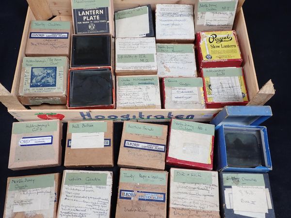 A QUANTITY OF BOXED LANTERN SLIDES