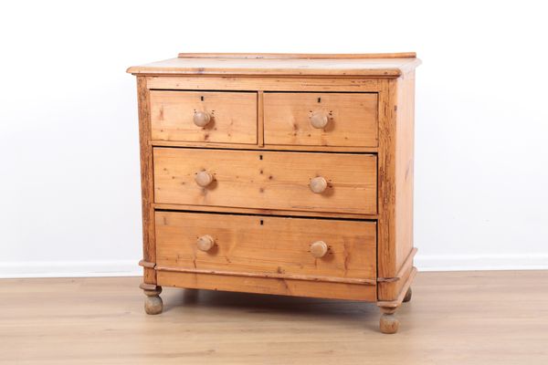 A VICTORIAN PINE CHEST OF DRAWERS