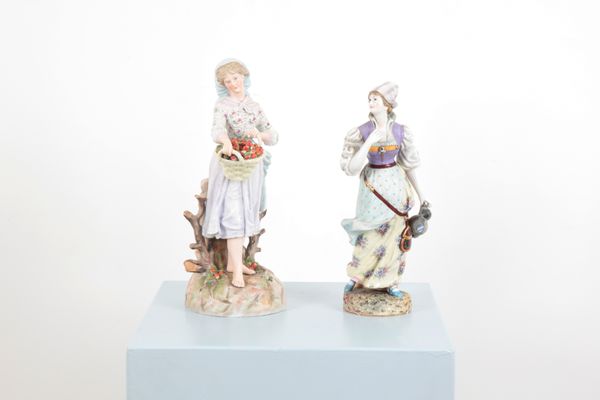 A PAIR OF PORCELAIN PROVINCIAL FEMALE FIGURES
