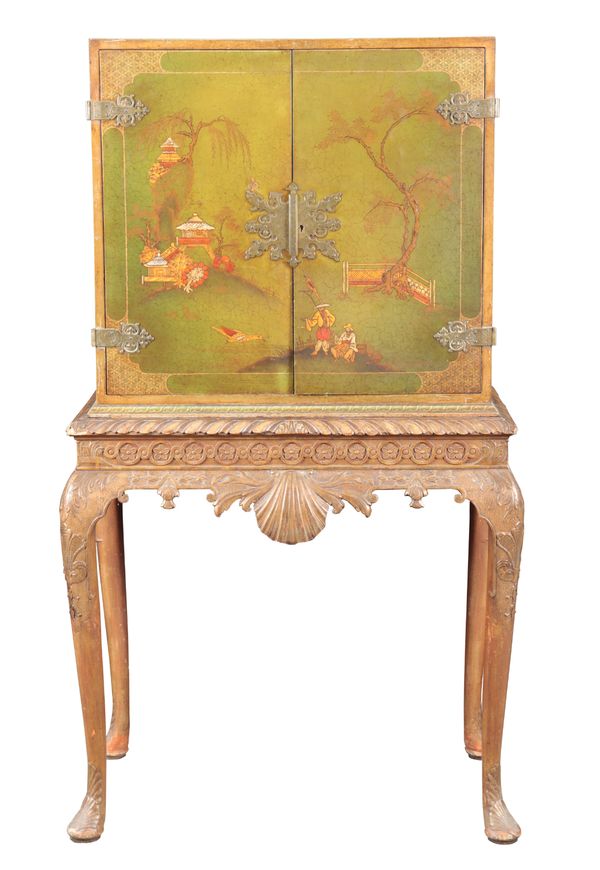 A GREEN LACQUERED, POLYCHROMED AND PARCEL GILT CABINET ON STAND