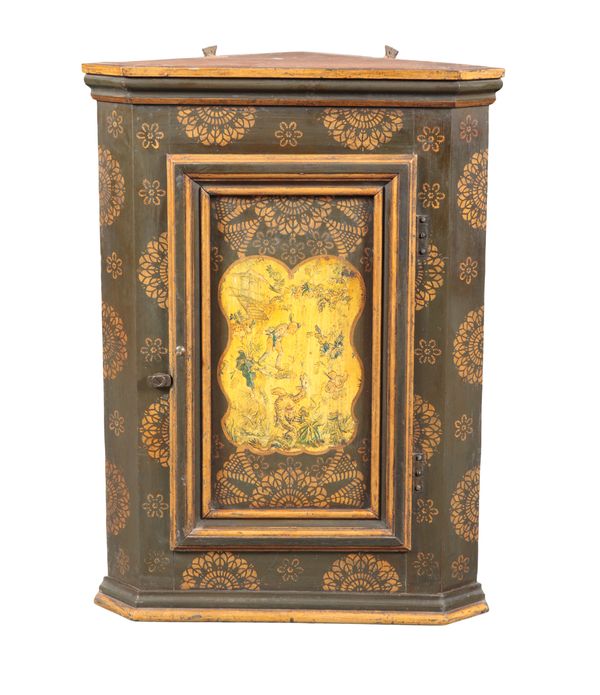 A CONTINENTAL POLYCHROME PAINTED PINE CORNER CUPBOARD