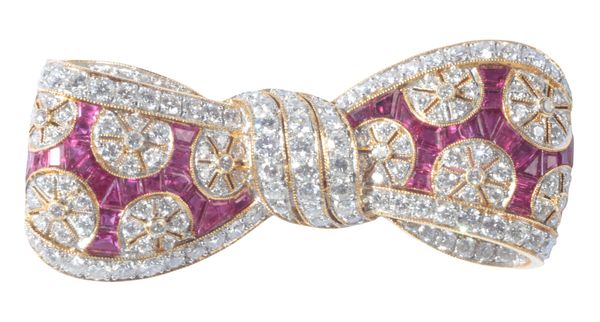 A VINTAGE RUBY AND DIAMOND BOW BROOCH
