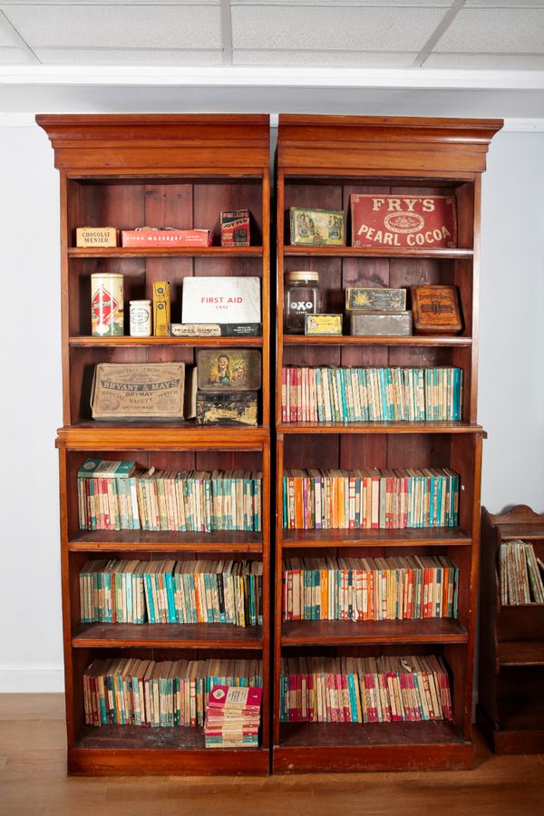 AN EDWARDIAN MAHOGANY TWO SECTION LIBRARY BOOKCASE