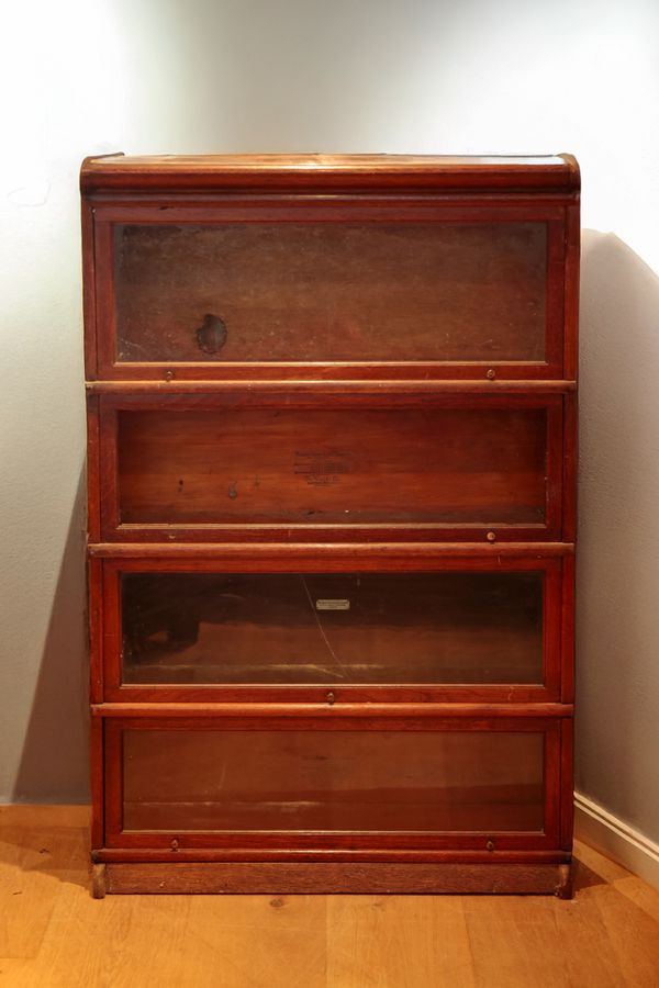 A GLOBE WERNICKE OAK FOUR TIER SECTIONAL BOOKCASE