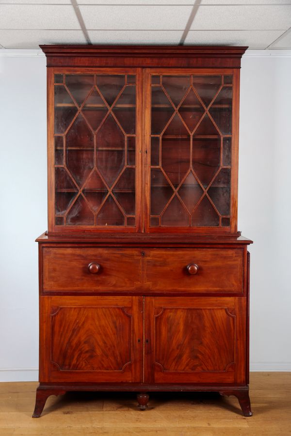AN EARLY VICTORIAN MAHOGANY SECRETAIRE BOOKCASE