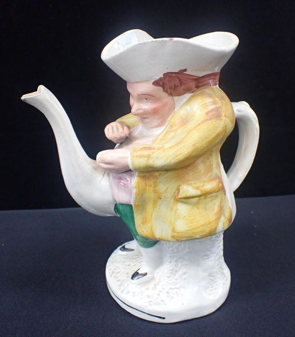 A SPOUTED STAFFORDSHIRE TOBY JUG