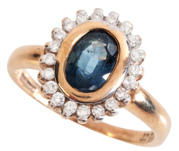 A SAPPHIRE AND DIAMOND CLUSTER RING