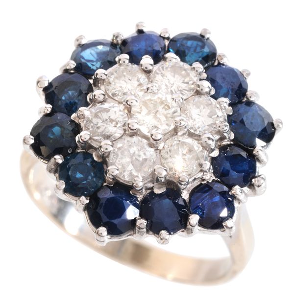 A SAPPHIRE AND DIAMOND CLUSTER RING