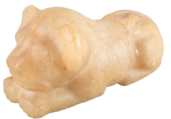 A NEAR EASTERN CARVED ALABASTER LIONESS