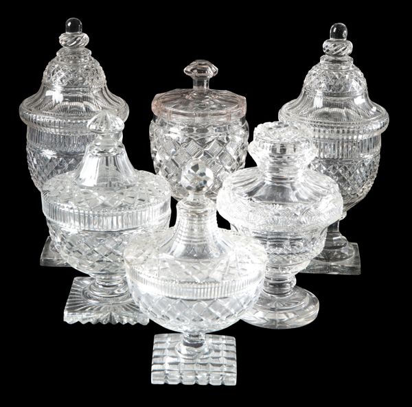 A PAIR OF CUT GLASS URNS AND COVERS