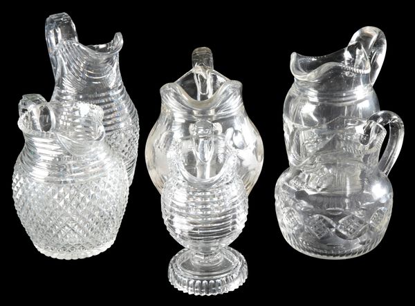 A COLLECTION OF SIX GLASS JUGS