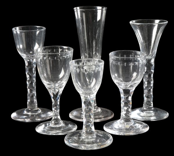 A COLLECTION OF FACETED STEM GLASSES