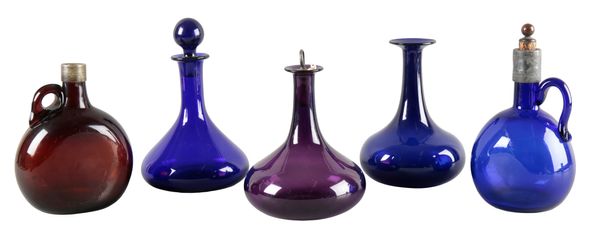 A COLLECTION OF COLOURED GLASS DECANTERS