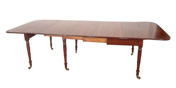 A GEORGE IV FIGURED MAHOGANY EXTENDING DINING TABLE