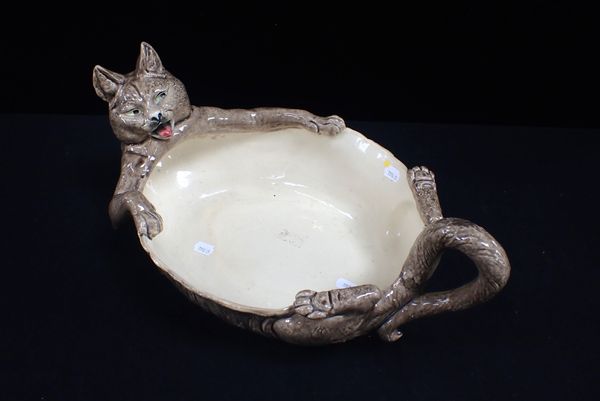 A FRENCH FAIENCE BOWL IN THE FORM OF A CAT LYING ON ITS BACK