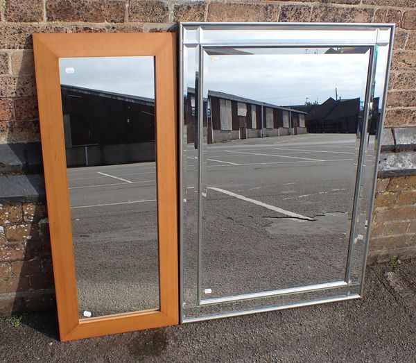 A LARGE RECTANGULAR MIRROR WITH MIRRORED BORDER