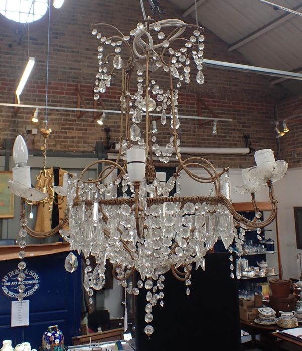 A CHANDELIER WITH PRISMATIC DROPS