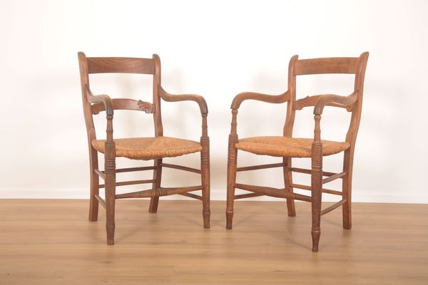 A RARE PAIR OF EARLY 19TH CENTURY ASH AND BEECHWOOD ARMCHAIRS