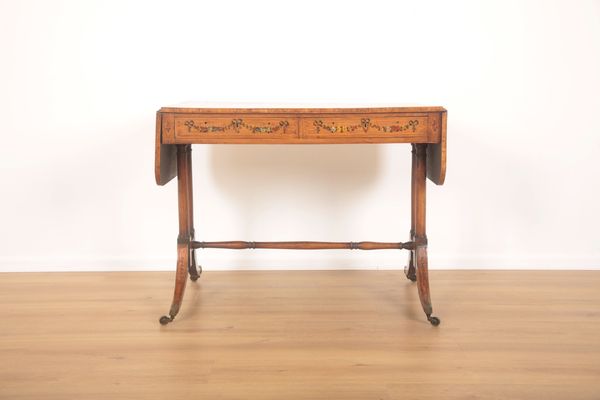 A SATINWOOD AND MAHOGANY SOFA TABLE