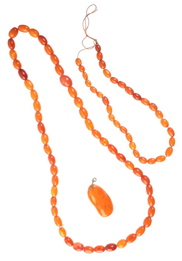 TWO AMBER BEAD NECKLACES AND A PENDANT