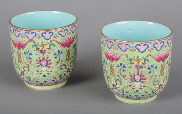 A PAIR OF CHINESE PORCELAIN GREEN GROUND FAMILLE ROSE TEA BOWLS