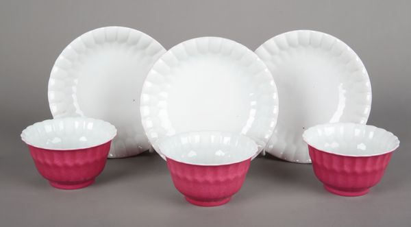 A SET OF THREE CHINESE PORCELAIN RUBY GLAZED TEABOWLS AND SAUCERS