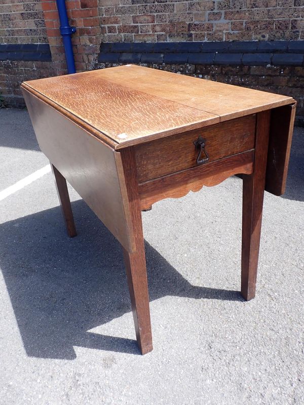 A 19th CENTURY OAK DROP-FLAP TABLE