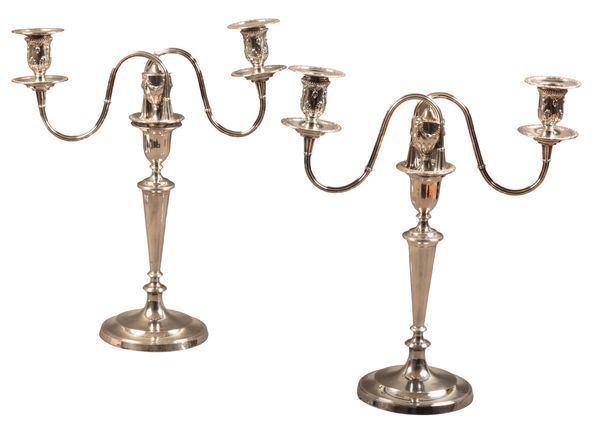 A PAIR OF SILVER PLATED CANDLESTICKS WITH ASSOCIATED ARMS