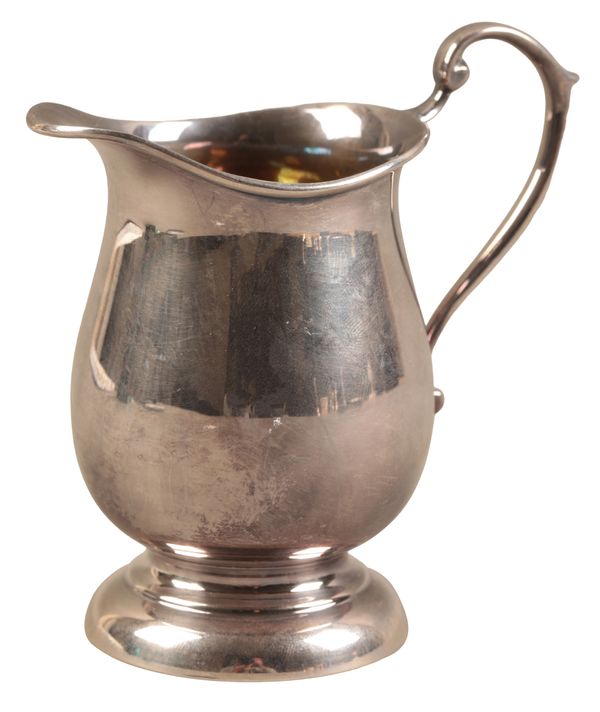 AN ELIZABETH II SILVER CREAM JUG