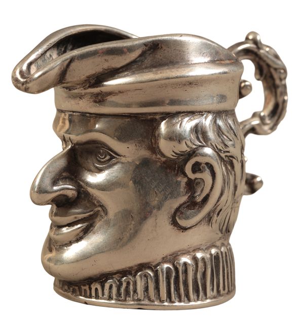 A GEORGE V SILVER ‘MR PUNCH’ NOVELTY CREAM JUG