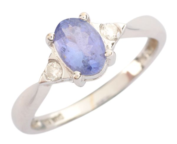 A TANZANITE AND DIAMOND THREE STONE RING