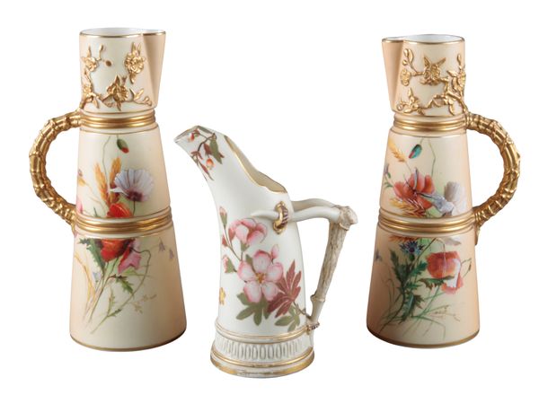 A PAIR OF ROYAL WORCESTER BLUSH IVORY EWERS