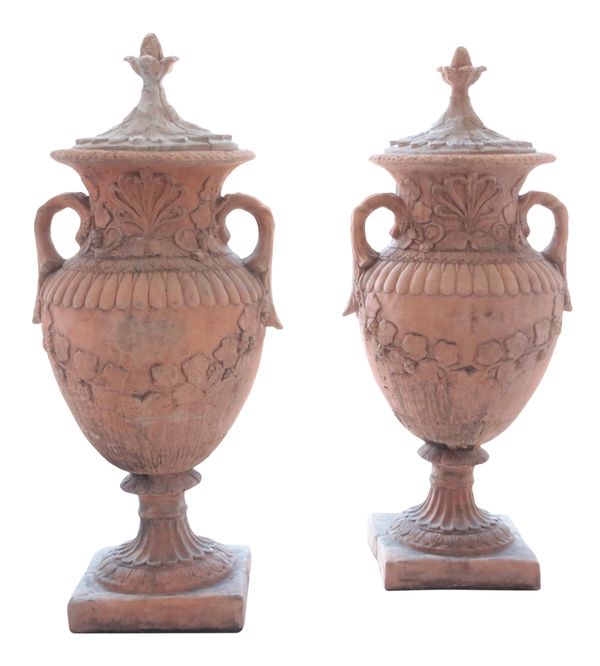 A PAIR OF LARGE TERRACOTTA COLOURED GARDEN URNS WITH COVERS