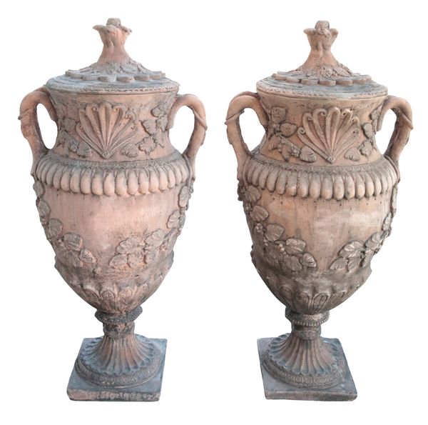 A PAIR OF TERRACOTTA COLOURED GARDEN URNS