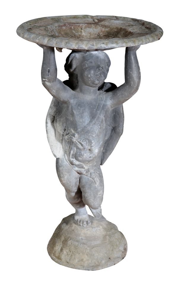 A LEAD BIRDBATH MODELLED AS A STANDING WINGED CHERUB