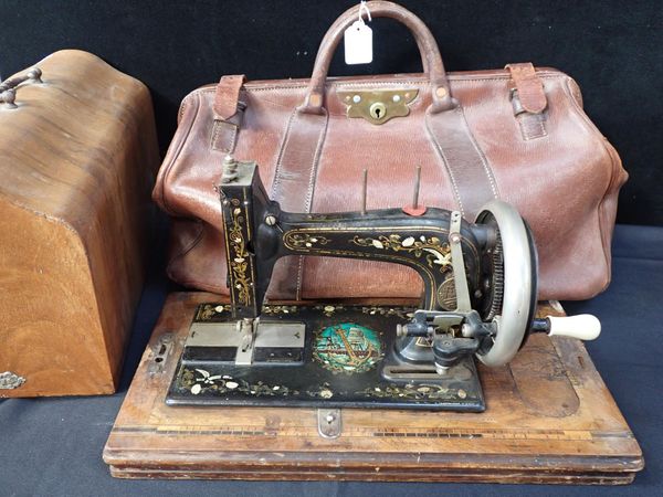 A LEATHER GLADSTONE BAG