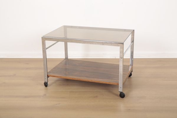 A MID CENTURY MDA HOWARD-MILLER CHROMED METAL AND ROSEWOOD COFFEE TABLE