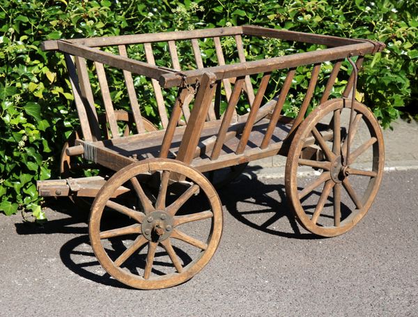 A VICTORIAN OAK DOG OR GOAT CART