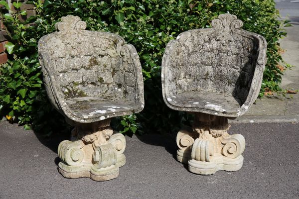 A PAIR OF RECONSTITUTED STONE GARDEN 'GROTTO' CHAIRS