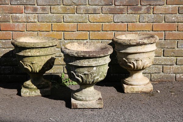 THREE SMALL RECONSTITUTED STONE URNS