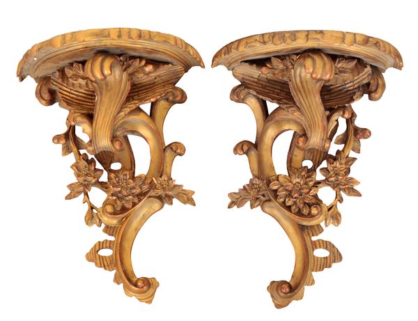 A PAIR OF ROCOCO STYLE CARVED GILTWOOD AND GESSO WALL BRACKETS